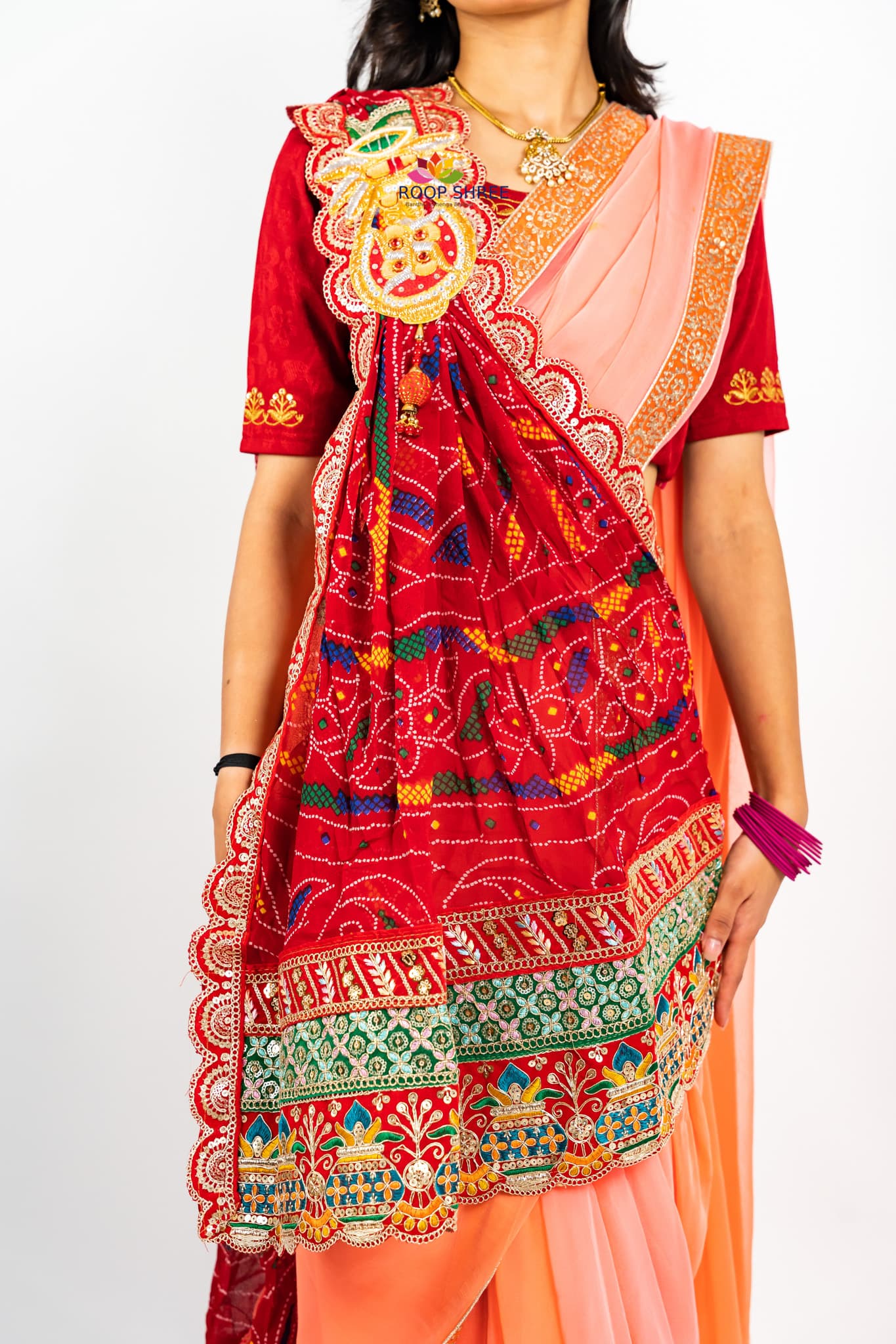 One side adorned with Kalash buta brooch