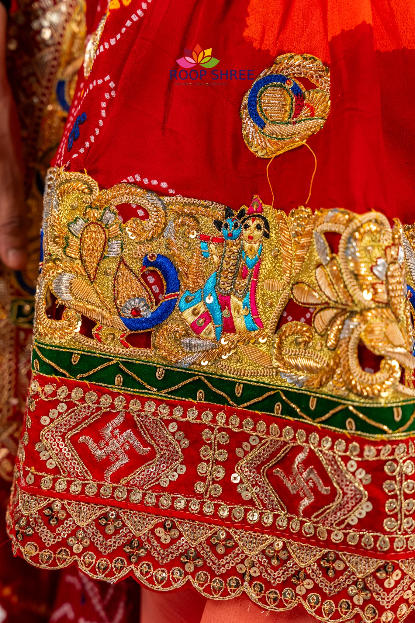 Traditional odhna adorned with Radha Krishna brooch for divine elegance.