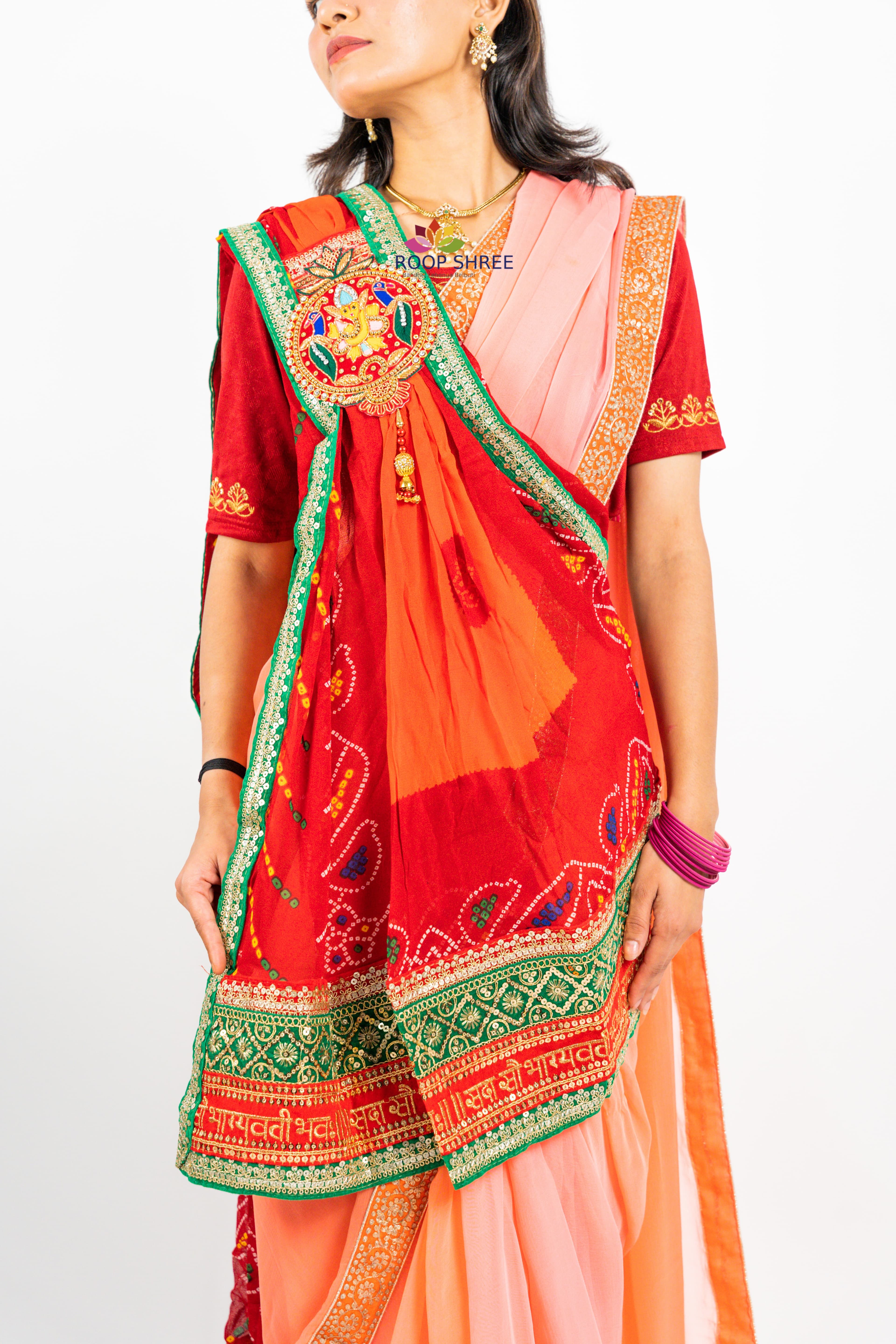 Traditional odhna adorned with  Ganesh brooch for divine elegance.
