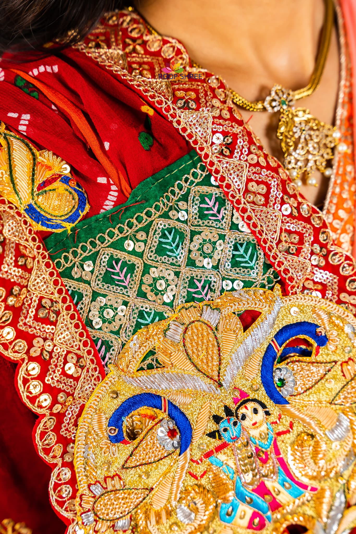 Traditional odhna adorned with Radha Krishna brooch for divine elegance.