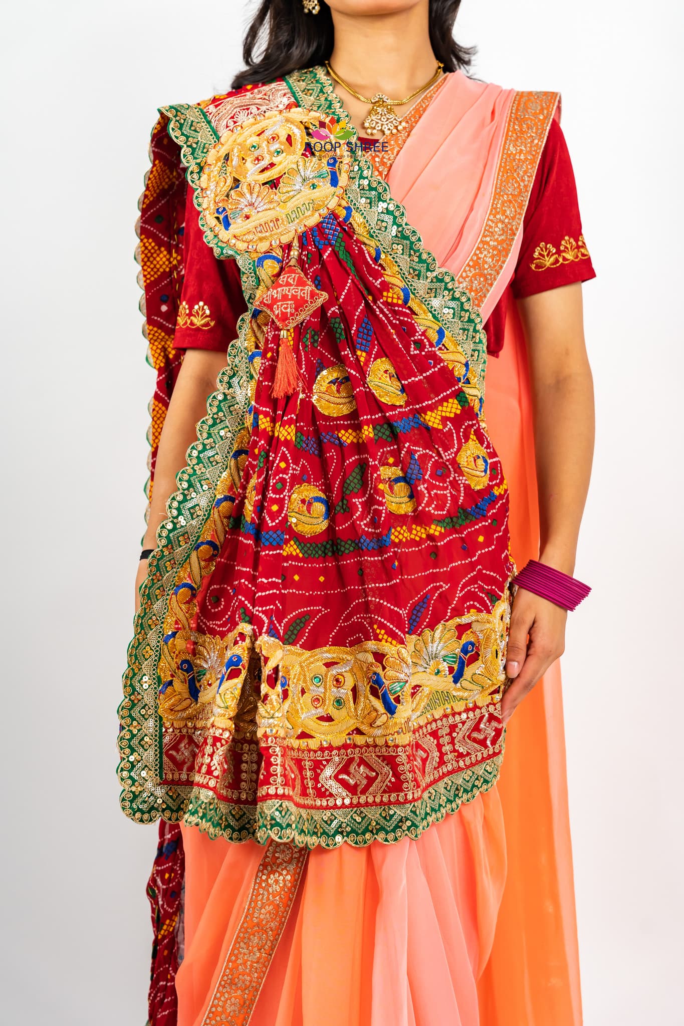 Elegant odhna with one-side brooch featuring Swastik Belbuti work.